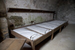 A Row of Wood-Framed Bunks