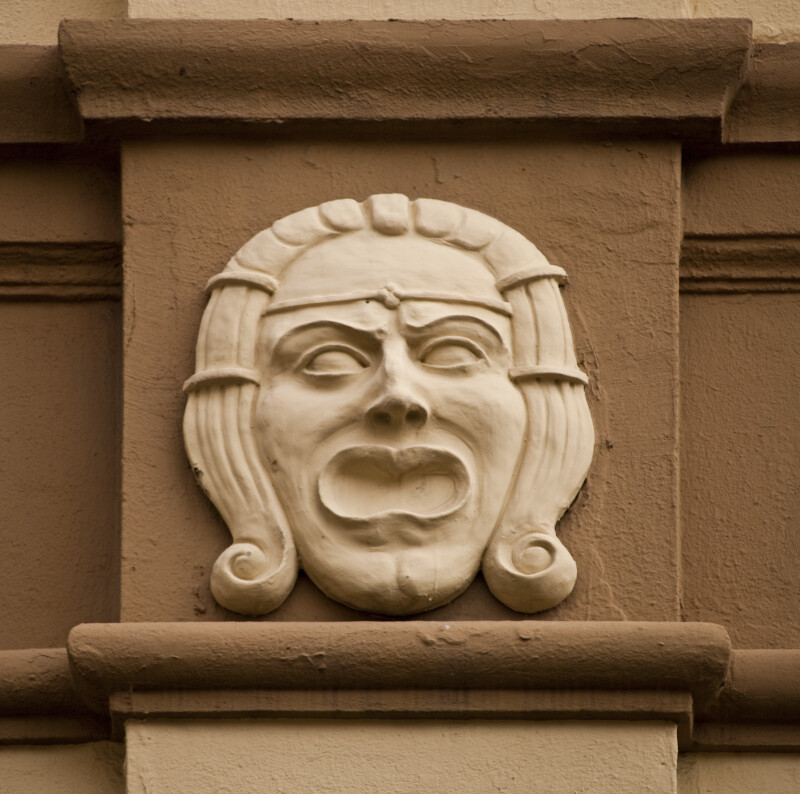 A Sculpted Face, with a Diadem, on a Building