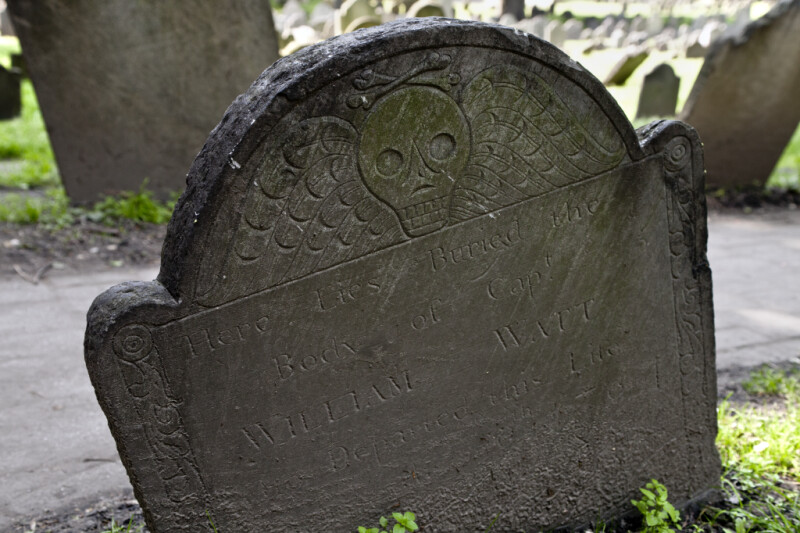 A Shouldered Tablet Headstone with a Death's Head Carving