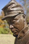 A Side View of the Face of a Bronze Sculpture Depicting a Soldier