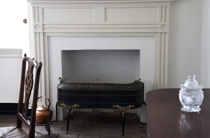 A Solid Fireplace Screen on Tall Legs