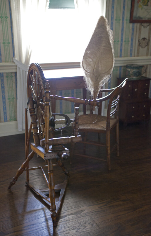 A Spinning Wheel by a Window