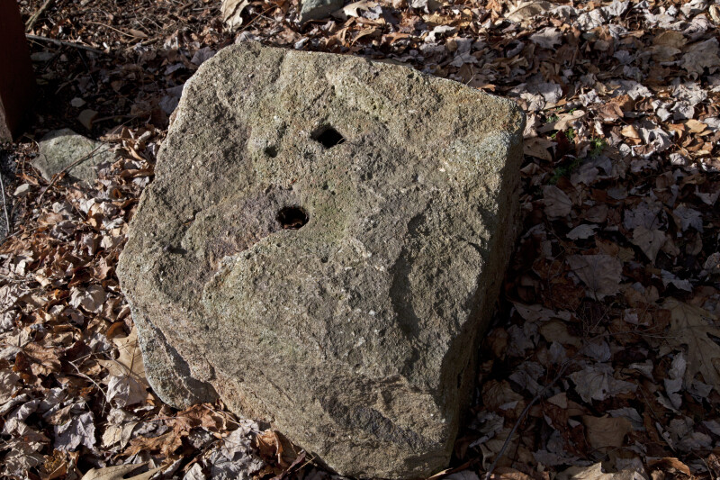 A Stone Block with Two Anthropogenic Holes