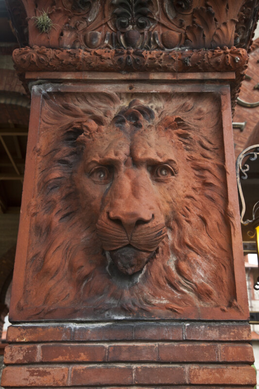 A Terracotta Lion on a Brick Pillar