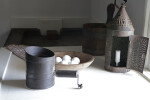 A Tin Lamp, a Flour Sifter, and a Bowl of Eggs