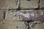 A View of Paint Peeling from a Brick Wall
