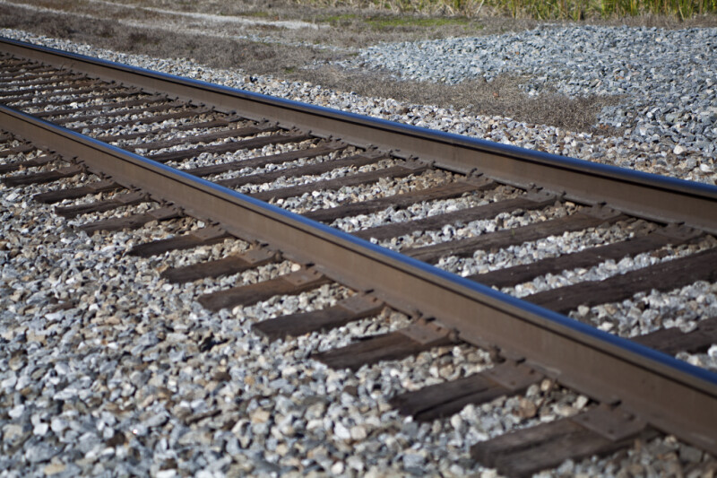 A View of Railroad Tracks and Ties in a Gravel Bed
