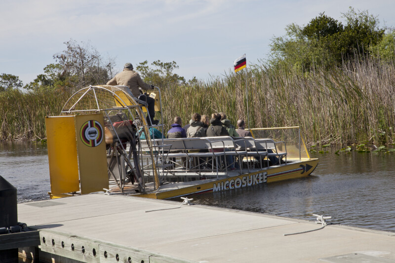 Airboat Full of Passengers Leaving a Dock