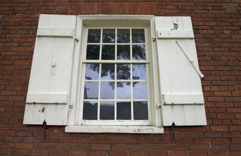 An Eight-Over-Twelve Sash Window with Shutters