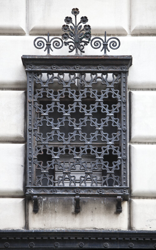 An Iron Grille over a Window