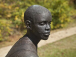 An Oblique View of the Face of a Bronze Figure Depicting a Young Boy at Corinth Contraband Camp