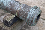 An Ornate Fleur-de-Lis Pattern Decorating the Barrel of a Cannon