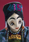 Azerbaijan Woman with Hand Painted Wood Face and Beaded Earrings (Close Up)