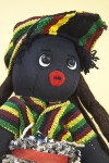 Bahamas Hand Made Figure of Man with Dreadlocks. Along with Buttons for Eyes, and Felt for His Mouth (Close Up)
