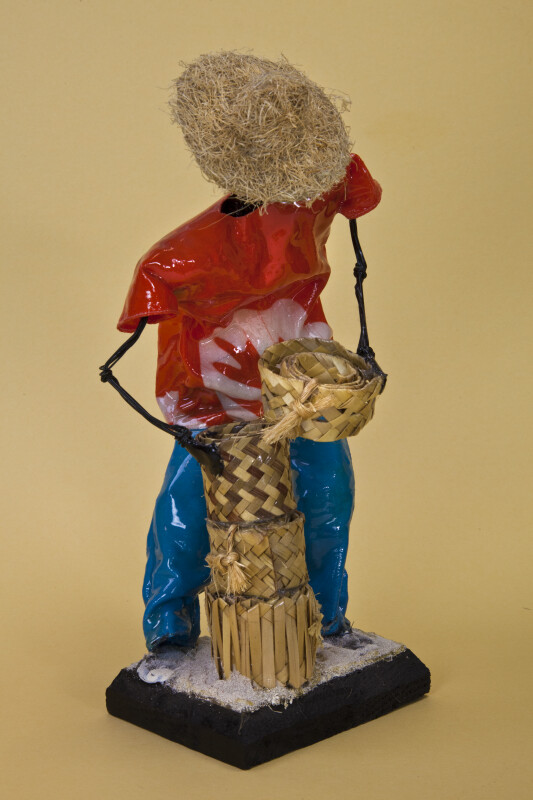 Bahamas Handcrafted Male Doll Made with Wire and Wearing a Straw Hat (Three Quarter View)