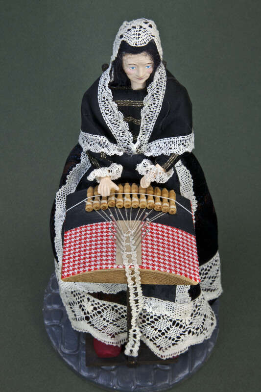 Belgium Figurine of Lady Making Lace in Traditional Manner with Bobbins and Thread (Top Down View)