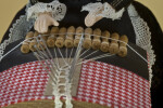Belgium Traditional Technique for Making Lace with Bobbins, Pillow, Pins, and Thread (Close Up of Lacing View)
