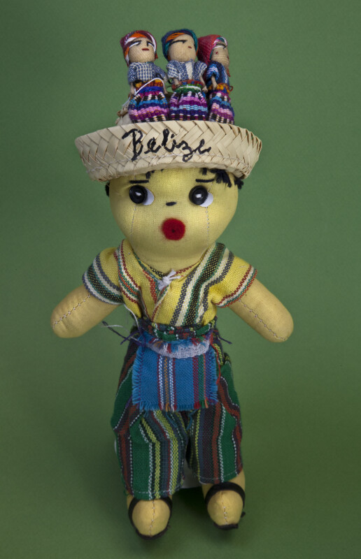 Belize Handcrafted Male Doll Wearing Bright Woven Vest, Pants, and Apron (Full View)