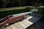 Blue Cannon on a Reddish-Brown Cannon Carriage Resting on a Wooden Firing Step