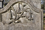 Broken Flowers Engraved on a Headstone