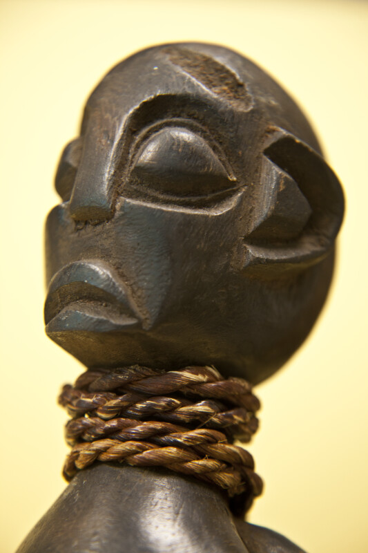 Cameroon Wood Carving of Man with Large Head, Flattened Nose, Large Ears and Spherical Eyes (Close Up)