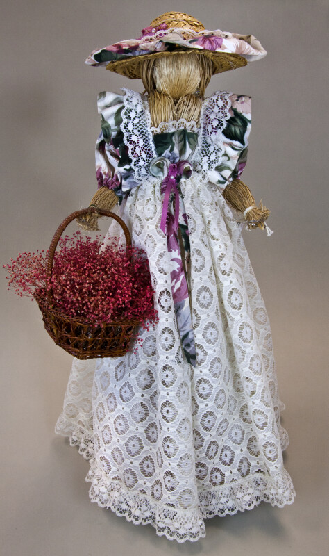Canada Ontario Female Doll Handcrafted from Straw Holding a Basket with Straw Flowers (Full View)