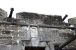 Cannons above a Coat of Arms