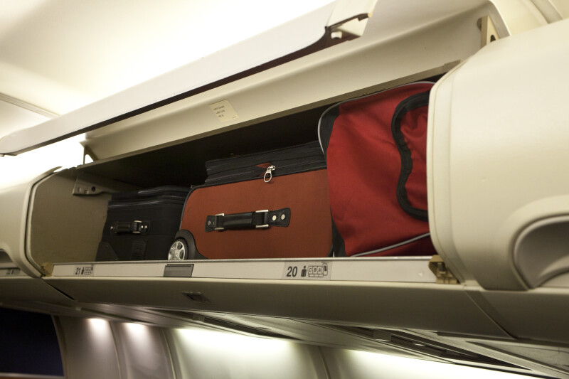 Carry-On Luggage Stowed in an Overhead Compartment