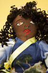 Cayman Islands Stuffed Doll with Curly Hair and Straw Hat (Close Up)