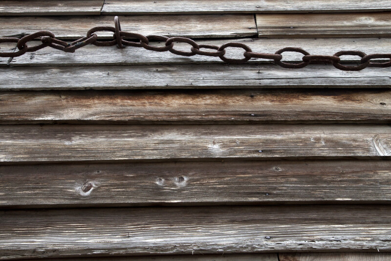 Chain Links Running through a Metal Eyelet
