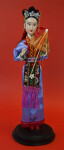 China Hong Kong Doll Made with Rubber Wearing a Brocade Apron (Full View)
