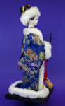 China Winter Doll with White Fur Hat and Trim on Brocade Coat (Profile View)