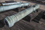 Close-Up of Bronze, Oxidized Cannons on a Wooden Plank at Castillo de San Marcos