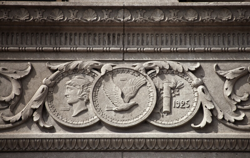 Coins Carved on a Bank Building