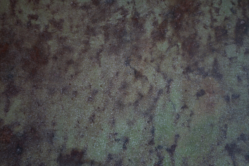 Concrete Floor with Green and Brown Stains