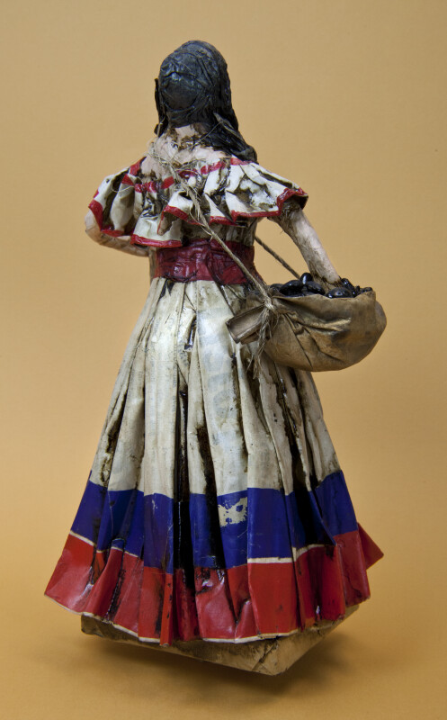 Costa Rica Lady Figurine with Long Dress, Bag with Coffee Beans, and Walking Stick (Back View)
