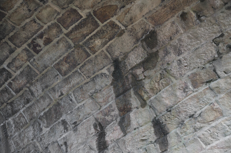 Damp Stones under the Arch of Skew Arch Bridge
