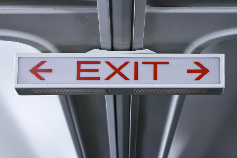 Dim Exit Sign with Arrows