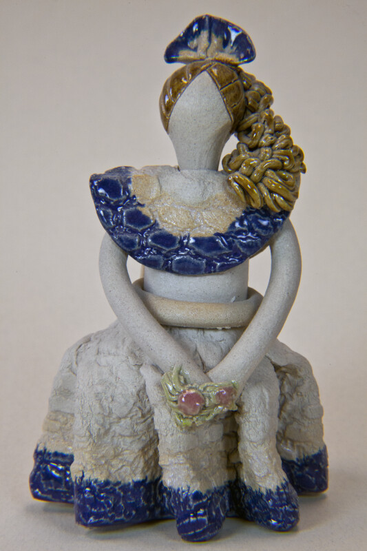 Dominican Republic Female Figurine in Long Dress Holding Glazed Flowers (Full View)