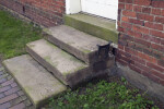 Dressed Stone Steps with a Boot Scraper on the Top Step