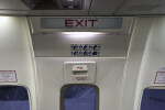 Exit Sign Above an Emergency Exit Door on an Airplane