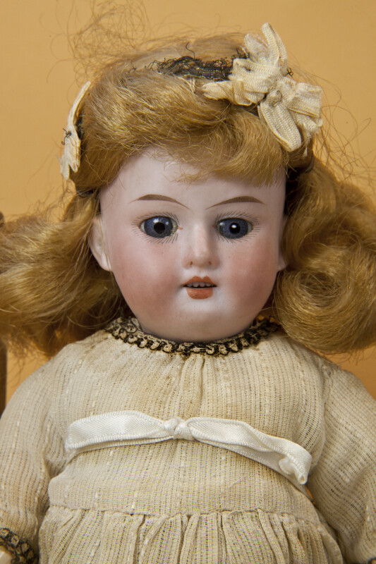 Germany, Antique Doll Made by Armand Marseille with Bisque Head and Jointed Wood Body (Close Up)