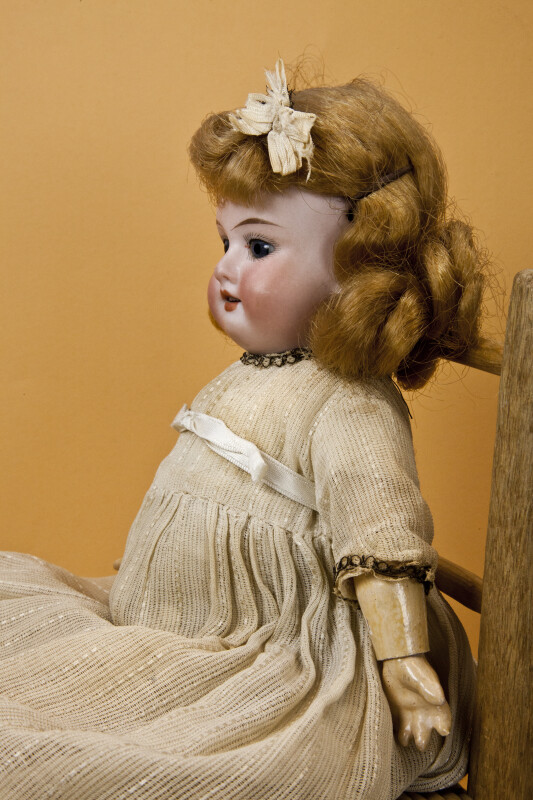 Germany, Antique Doll with Bisque Head, Glass Eyes, Jointed Wood Body, and Removable Wig (Profile)