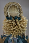 Germany Doll with Wheat Torso and Straw Arms Wearing Straw Hat over Straw Braids (Close Up)