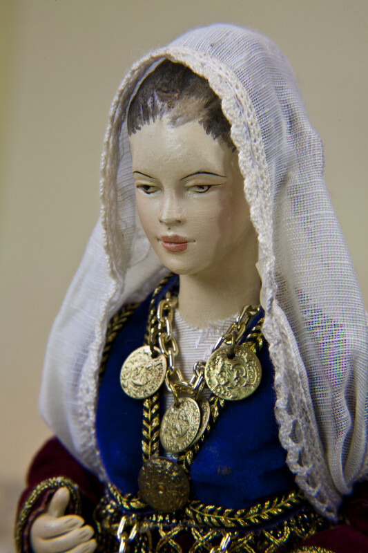 Greece Porcelain Doll Wearing Coin Jewelry and National Costume (Close Up)