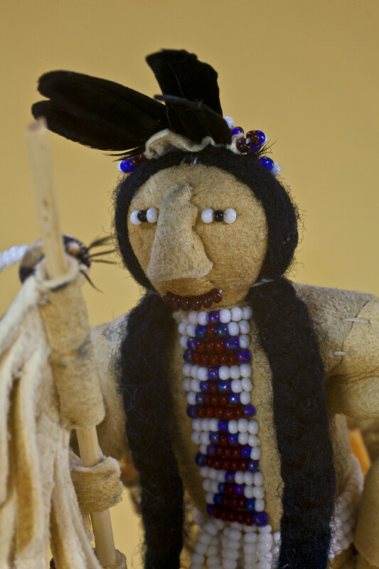 Idaho Indian Doll Made from Wood, Feathers, Fur and Leather with Beads for Eyes and Mouth (Close Up)