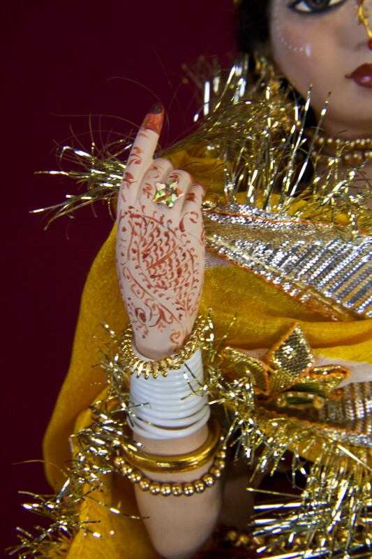 India Hand of Rajasthani Bride with Red Henna and Gold Bracelets (Close Up of Hand)