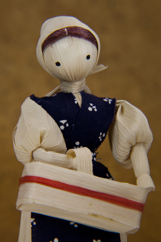 Iowa Cornhusk Doll of Woman Holding Cornhusk Basket (Close Up)