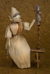 Iowa Cornhusk Woman Sitting on Bench Spinning Wool (Full View)