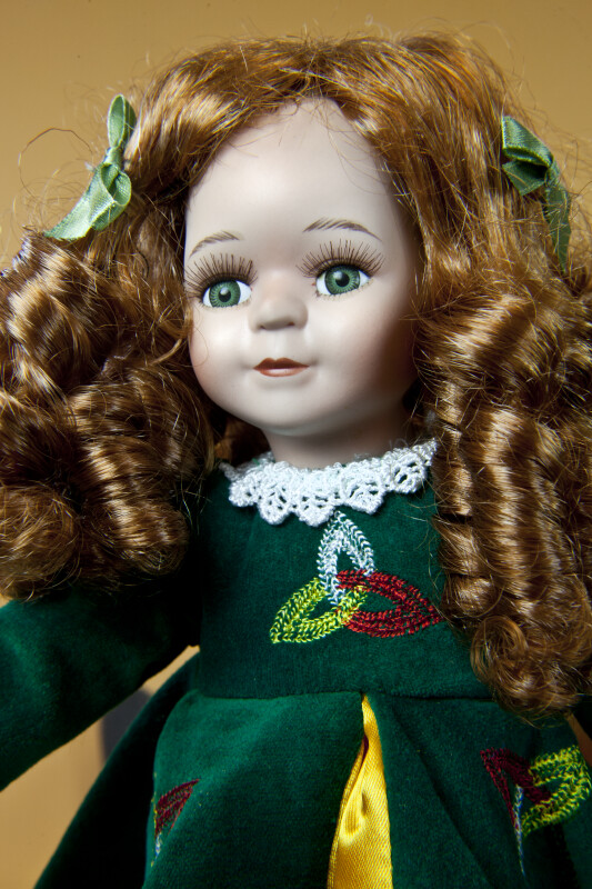 Ireland Red-Haired Irish Lass with Green Eye and a Green Dress and Triquetra Symbol (Close Up)